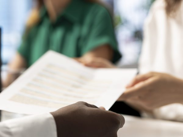 HR department coworkers prepare interview questions to vet selected applicants and ensure their skills are strong enough match for the role. Close up of headhunters assessing candidate work experience
